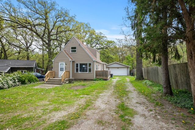 view of front facade featuring fence, an outbuilding, a garage, and crawl space