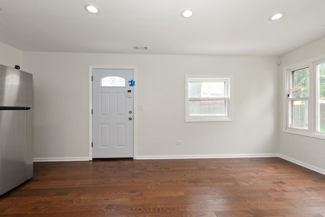 entrance foyer with recessed lighting, dark wood-style flooring, and baseboards