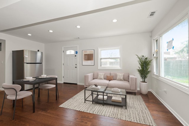 living area with plenty of natural light, dark wood-style floors, recessed lighting, and baseboards