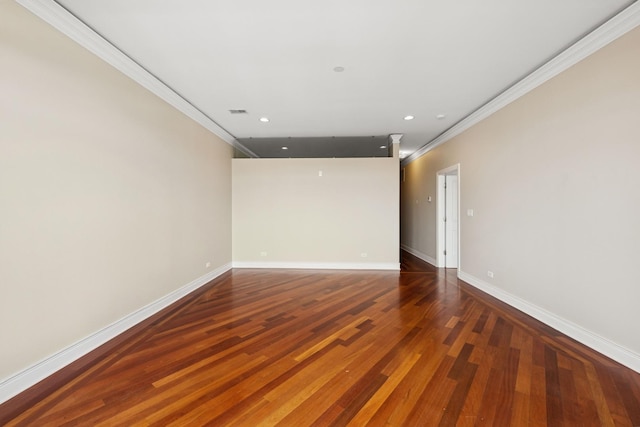 unfurnished room with visible vents, baseboards, recessed lighting, wood finished floors, and crown molding