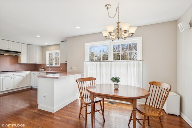 910 Lane, Lorraine, Lake Forest, IL 60045 - dining space with dark wood-style flooring, baseboards, visible vents, recessed lighting, and a notable chandelier