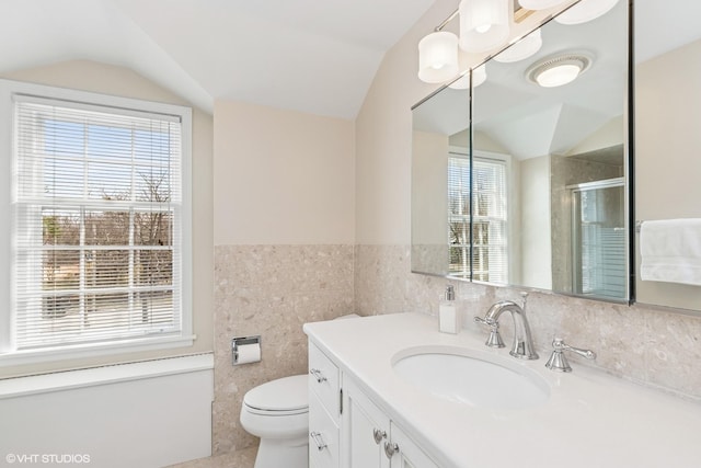 910 Lane, Lorraine, Lake Forest, IL 60045 - bathroom featuring tile walls, vaulted ceiling, vanity, and a shower stall