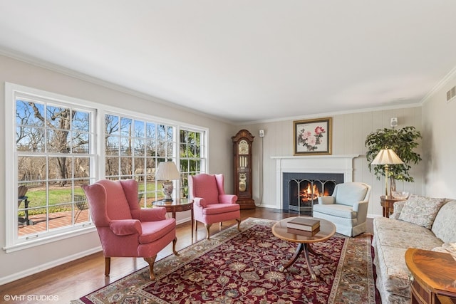 910 Lane, Lorraine, Lake Forest, IL 60045 - living room with a lit fireplace, baseboards, wood finished floors, and ornamental molding