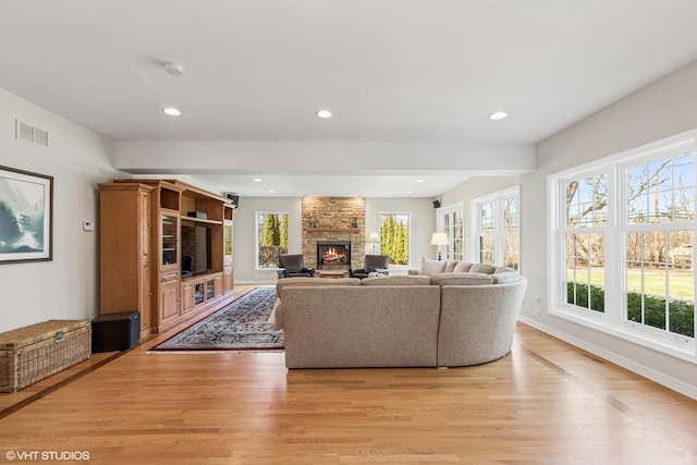 910 Lane, Lorraine, Lake Forest, IL 60045 - living area with light wood-type flooring, baseboards, recessed lighting, visible vents, and a stone fireplace