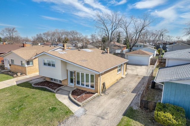 view of front facade featuring a residential view, a front yard, brick siding, a garage, and a shingled roof
