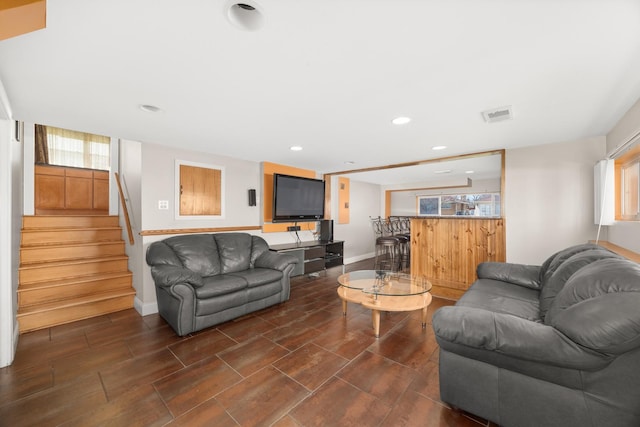 living room featuring recessed lighting, stairway, visible vents, and baseboards