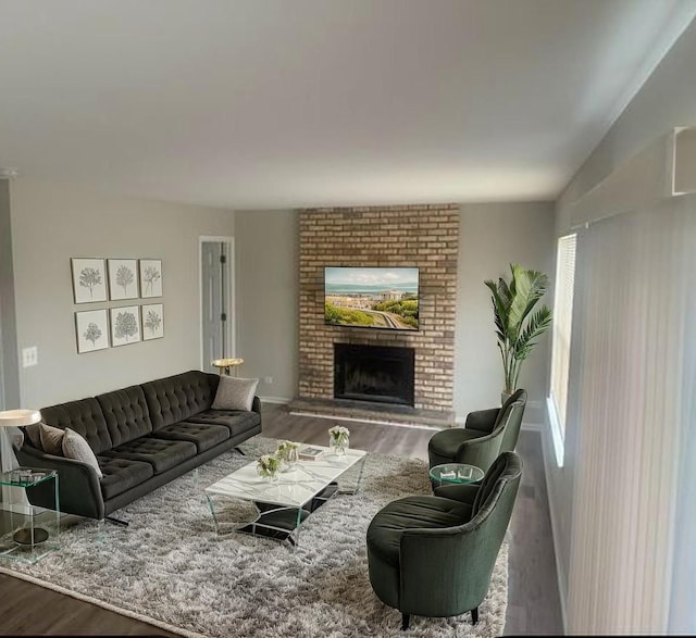 2910 W Clearview Ave, Waukegan, IL 60085 - living area with a fireplace, baseboards, and wood finished floors