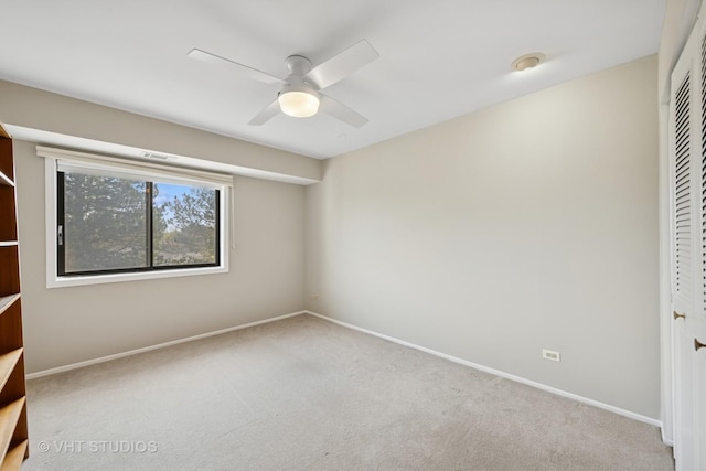 unfurnished bedroom with baseboards, visible vents, carpet, and a closet