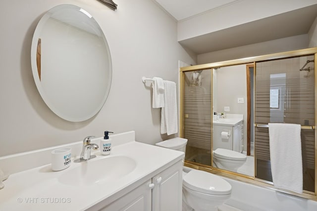 bathroom featuring vanity, an enclosed shower, and toilet