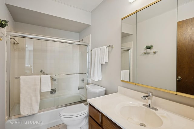 full bathroom with toilet, combined bath / shower with glass door, and vanity