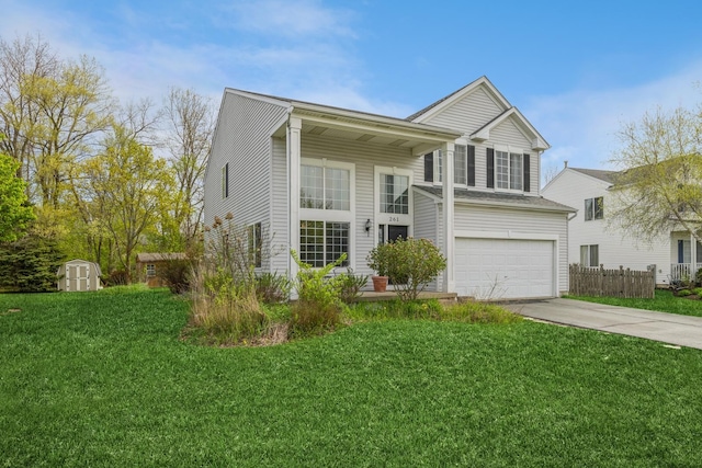 view of front of home featuring driveway, a front lawn, a shed, and a garage