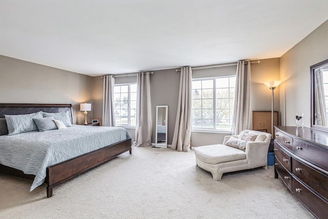 bedroom featuring light carpet
