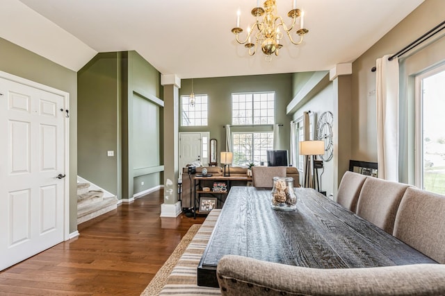 dining room featuring an inviting chandelier, stairs, dark wood-style floors, and a wealth of natural light