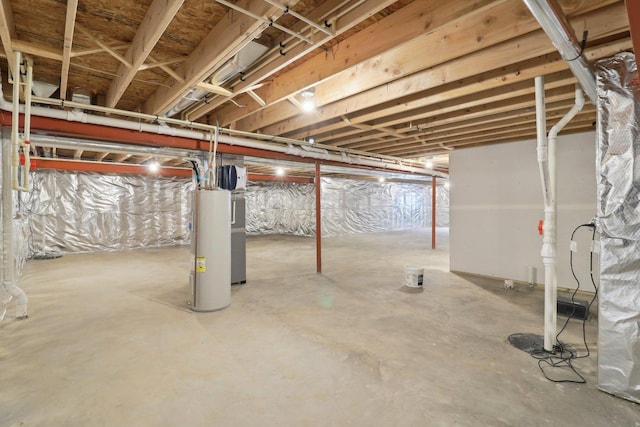 unfinished below grade area featuring water heater