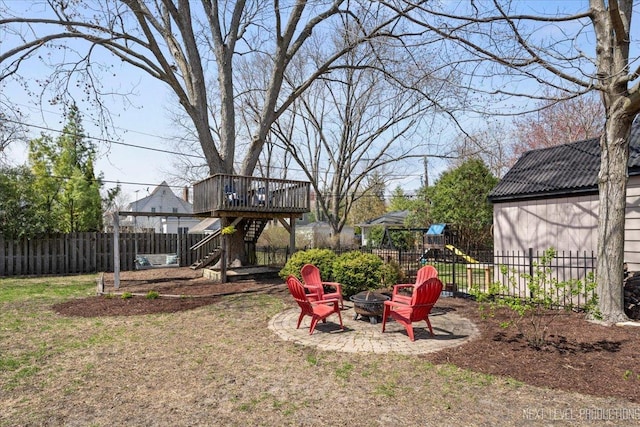 349 N Lincoln St, Batavia, IL 60510 - view of yard with a fenced backyard, an outdoor fire pit, stairs, and a deck