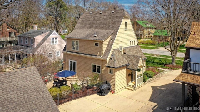 349 N Lincoln St, Batavia, IL 60510 - rear view of house featuring roof with shingles, a patio, and entry steps