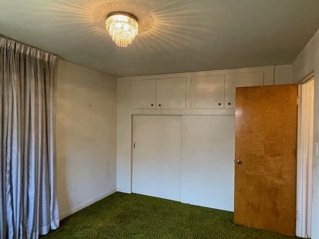 unfurnished bedroom with carpet flooring and a closet