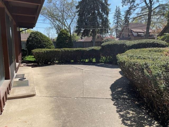 view of patio / terrace featuring fence
