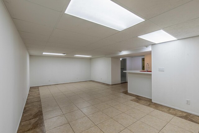 854 Kings Cv, Princeton, IL 61356 - spare room with a drop ceiling, a sink, and baseboards