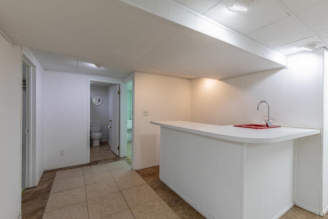 854 Kings Cv, Princeton, IL 61356 - bar area featuring light tile patterned floors and a sink