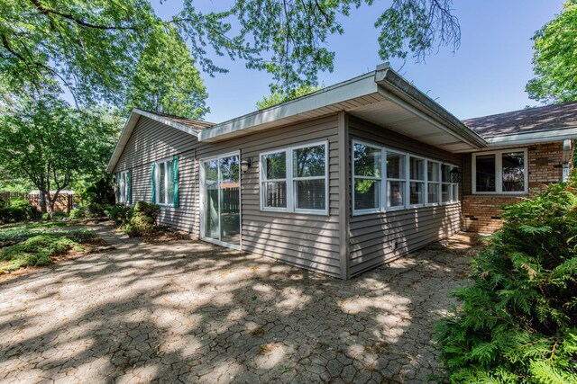 854 Kings Cv, Princeton, IL 61356 - view of property exterior featuring a patio area and brick siding