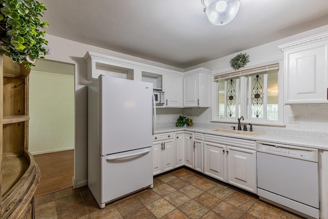 854 Kings Cv, Princeton, IL 61356 - kitchen featuring white appliances, a sink, stone tile floors, light countertops, and white cabinetry