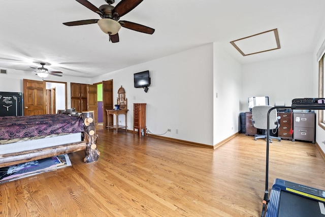 bedroom featuring baseboards, visible vents, attic access, and light wood-type flooring