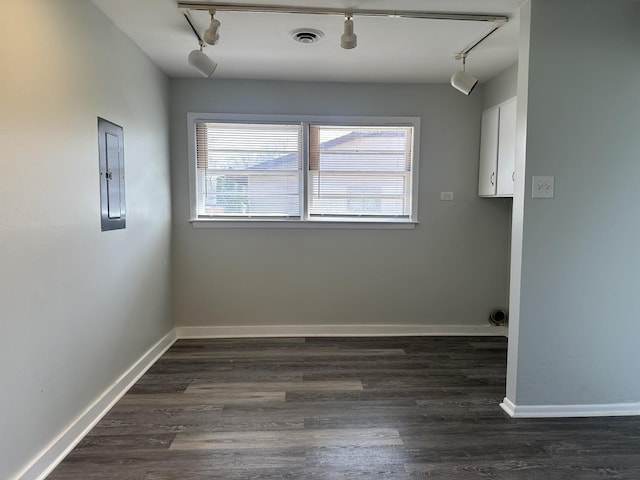 1525 Gordon Ave, Calumet City, IL 60409 - unfurnished room with track lighting, visible vents, dark wood-type flooring, electric panel, and baseboards