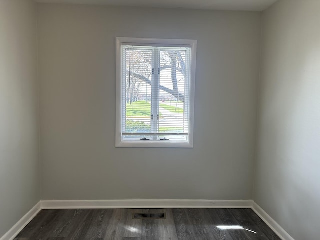 1525 Gordon Ave, Calumet City, IL 60409 - empty room featuring visible vents, baseboards, and dark wood-style flooring
