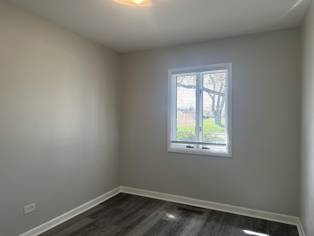 1525 Gordon Ave, Calumet City, IL 60409 - spare room with visible vents, baseboards, and dark wood-type flooring