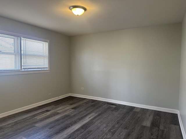 1525 Gordon Ave, Calumet City, IL 60409 - empty room with visible vents, baseboards, and dark wood-style floors