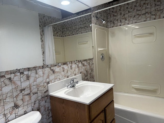 1525 Gordon Ave, Calumet City, IL 60409 - full bath with toilet, vanity, tile walls, decorative backsplash, and shower / bath combo