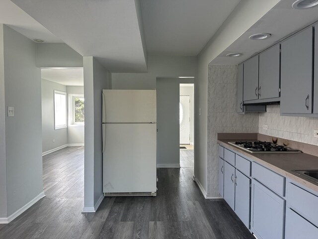 1525 Gordon Ave, Calumet City, IL 60409 - kitchen with freestanding refrigerator, baseboards, dark wood-style flooring, and gas cooktop