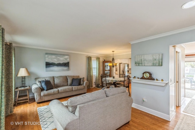 2107 Lawson Blvd, Gurnee, IL 60031 - living room featuring light wood-style floors, ornamental molding, and baseboards