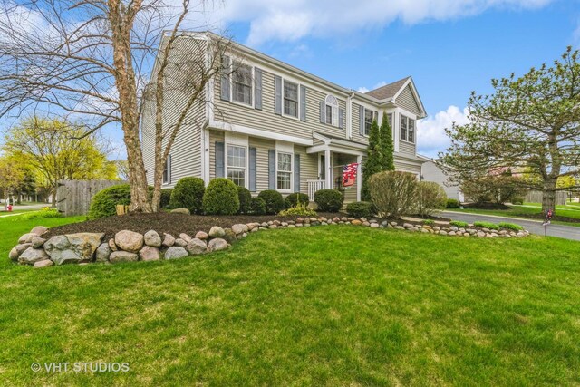 2107 Lawson Blvd, Gurnee, IL 60031 - view of front facade with fence and a front lawn