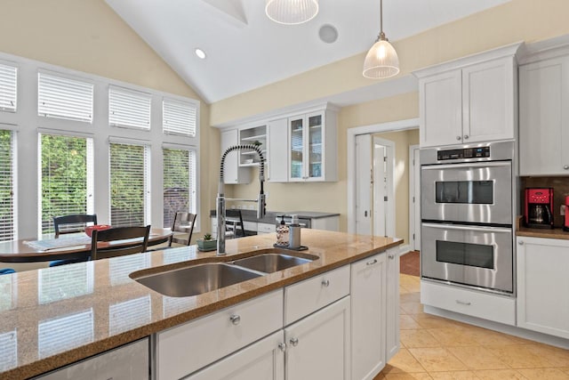 860 Kenton Rd, Deerfield, IL 60015 - kitchen with double oven, white cabinetry, light tile patterned flooring, pendant lighting, and glass insert cabinets