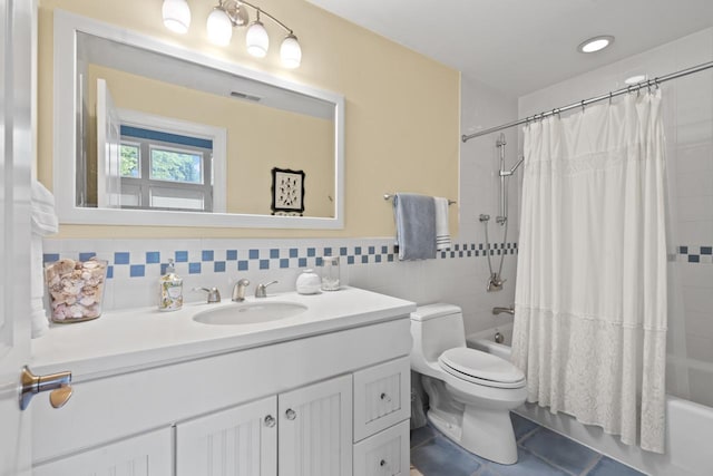 860 Kenton Rd, Deerfield, IL 60015 - bathroom with vanity, shower / bath combo with shower curtain, tile patterned floors, and tile walls
