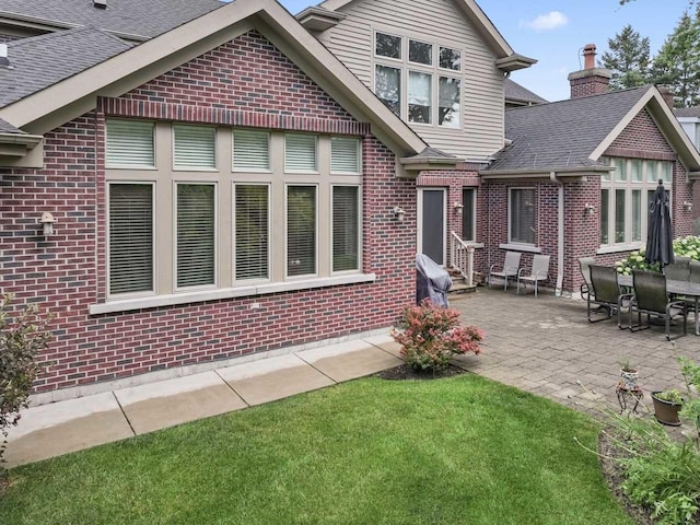 860 Kenton Rd, Deerfield, IL 60015 - back of property featuring brick siding and a patio