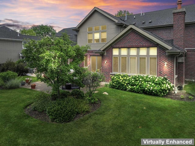 860 Kenton Rd, Deerfield, IL 60015 - back of house featuring a lawn and brick siding