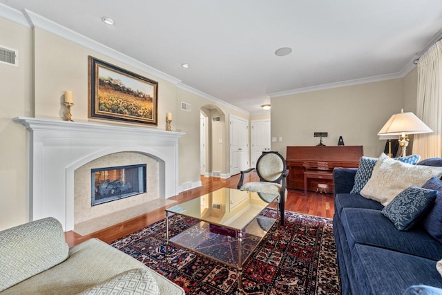 860 Kenton Rd, Deerfield, IL 60015 - living area featuring wood finished floors, arched walkways, ornamental molding, and a high end fireplace