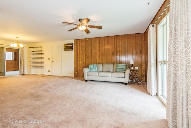 14937 Highland Ave, Orland Park, IL 60462 - living area featuring a chandelier, carpet floors, a ceiling fan, a wall mounted air conditioner, and wood walls