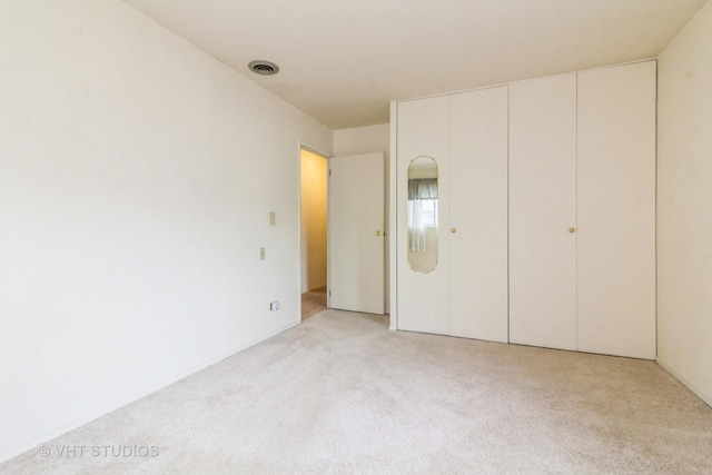 14937 Highland Ave, Orland Park, IL 60462 - unfurnished bedroom featuring light colored carpet and a closet