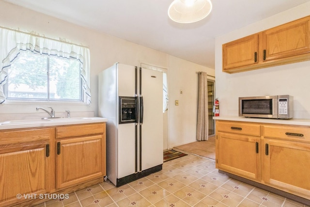 14937 Highland Ave, Orland Park, IL 60462 - kitchen featuring stainless steel microwave, white refrigerator with ice dispenser, and light countertops