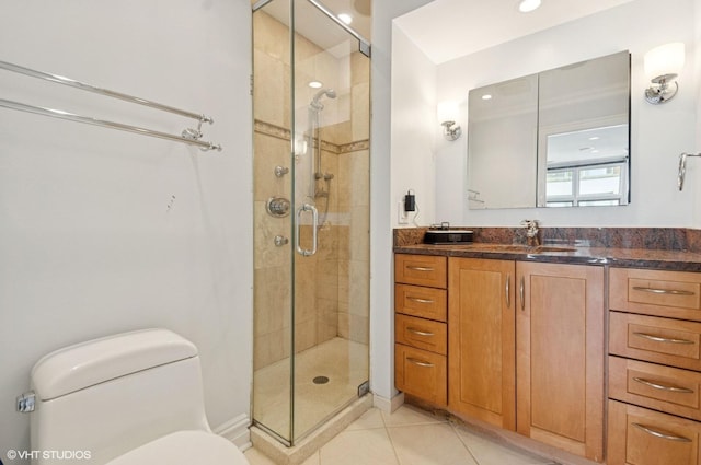 bathroom with toilet, recessed lighting, vanity, tile patterned floors, and a stall shower