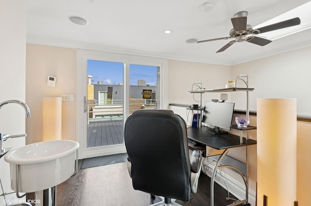 office featuring crown molding, wood finished floors, ceiling fan, and baseboards