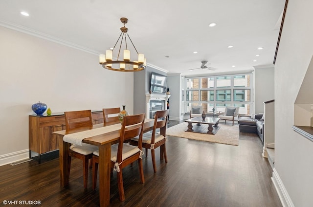 dining space featuring recessed lighting, dark wood-style flooring, and ornamental molding