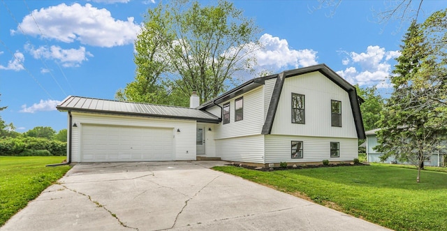 1801 Cindy Lynn St, Urbana, IL 61802 - split level home featuring a front lawn, a garage, concrete driveway, and a chimney