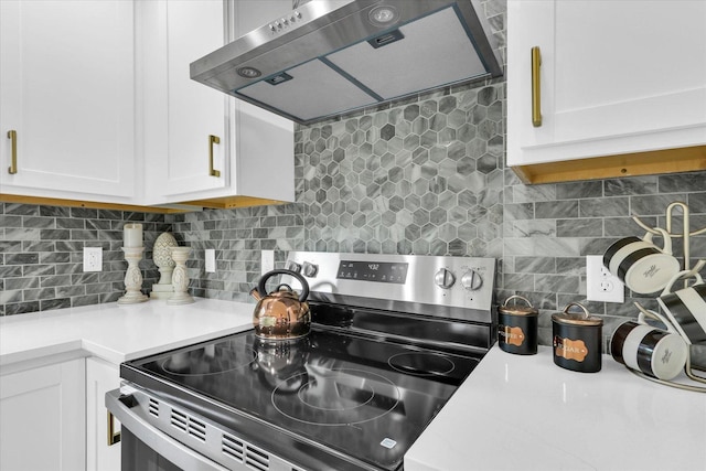 1801 Cindy Lynn St, Urbana, IL 61802 - kitchen featuring stainless steel range with electric cooktop, ventilation hood, white cabinets, decorative backsplash, and light countertops