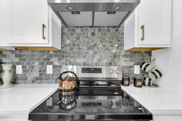 1801 Cindy Lynn St, Urbana, IL 61802 - kitchen with stainless steel electric range, extractor fan, light countertops, and white cabinetry