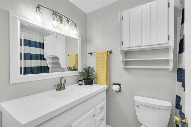 1801 Cindy Lynn St, Urbana, IL 61802 - bathroom featuring toilet, vanity, and baseboards